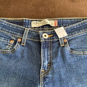 Levi’s 518  Super low boot cut,  dark med wash size 1, medium Junior, good cond